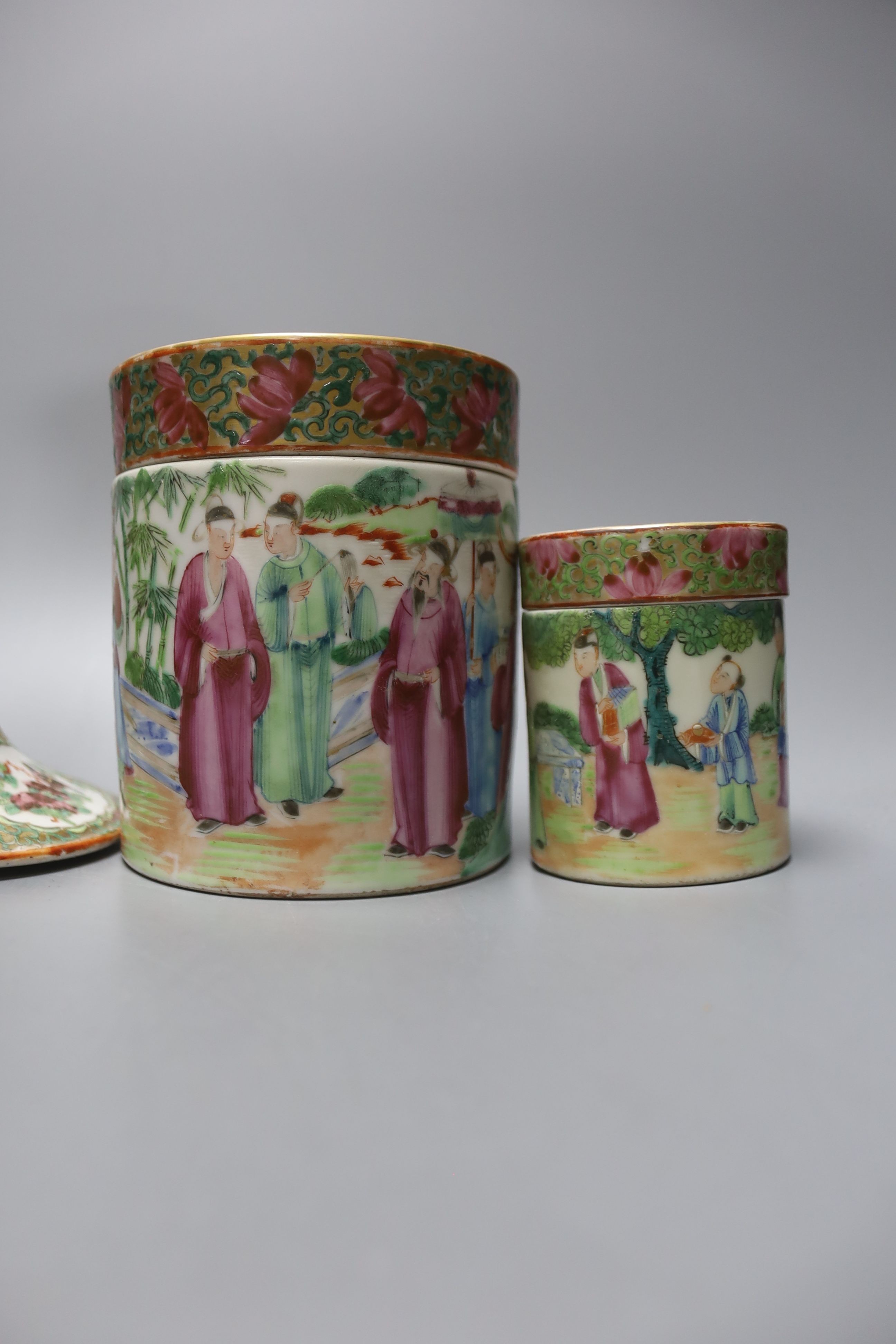 A Chinese Canton famille rose nest of boxes and covers, a similar candlestick and a tray 23cm